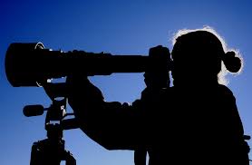 man with telescope 